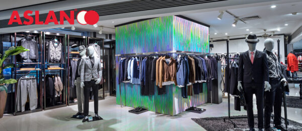 Boutique display window with mannequins in fashionable dresses